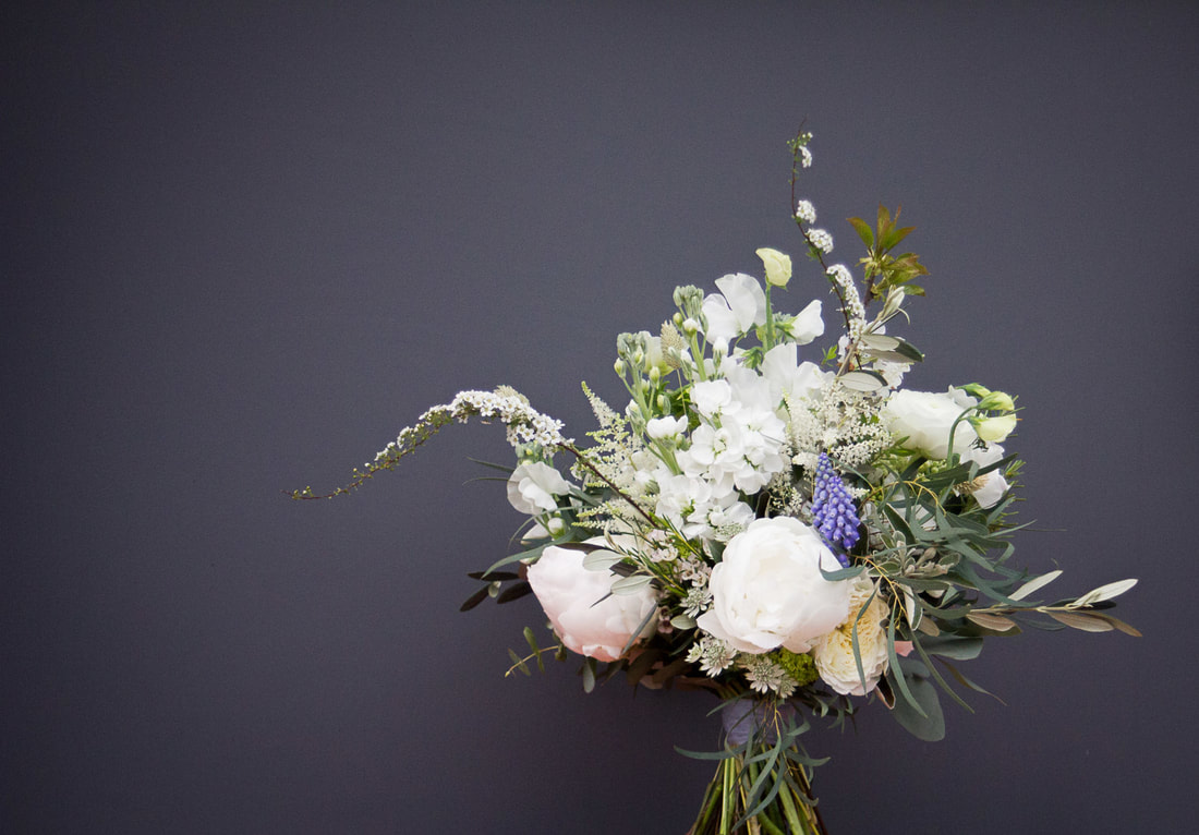 Spring flower posy in shades of cream and blue