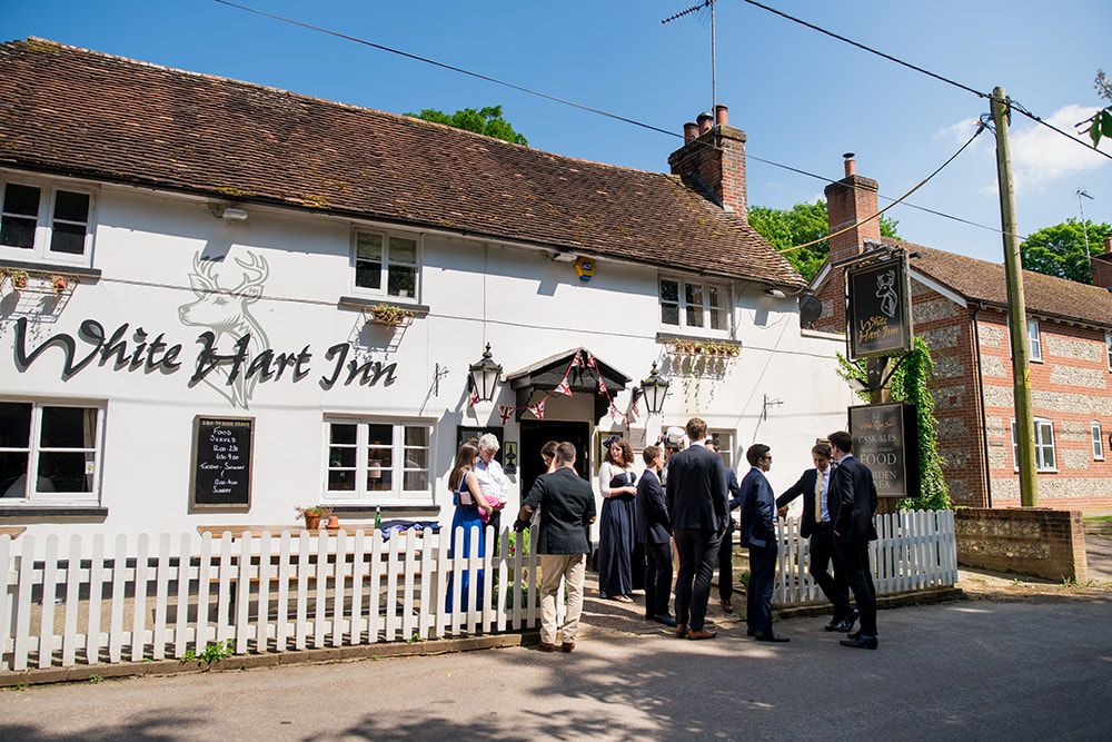 Part of the wedding experience, a quick toast at the local village pub before the church service, in Penton Mewsey just by Penton Park, exclusive wedding venue Hampshire